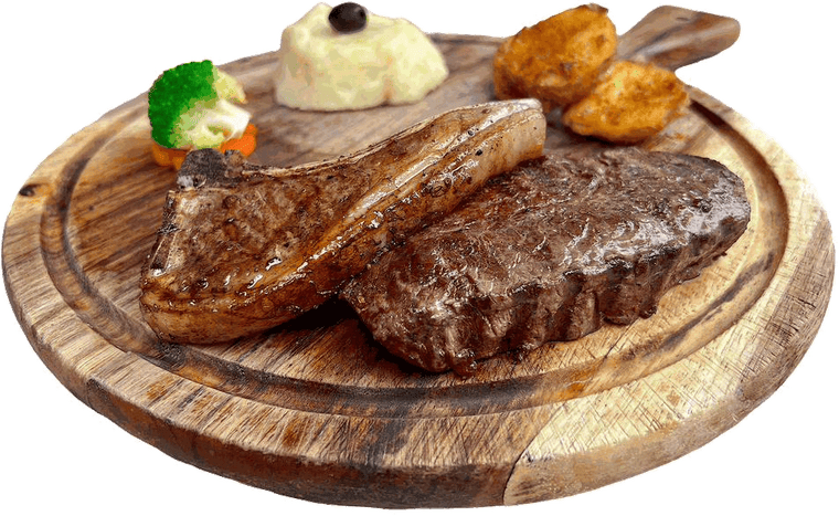 Grilled steak and lamb chop with mashed and roast potatoes on a wooden board at Poly Pizza Sen Sok